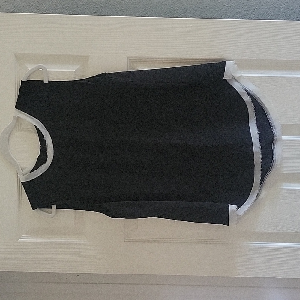 Black tank with white feathered trim